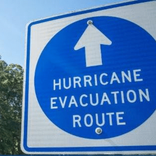 image of road sign reading "hurricane evacuation route" with an arrow pointing forwards